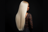 Back view of brown-skinned model wearing 613 blonde straight wig