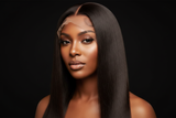 Black woman wearing raw 13x4 straight lace front wig