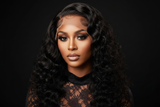 Brown-skinned model wearing luxury custom deep wave wig with lashes and lace top
